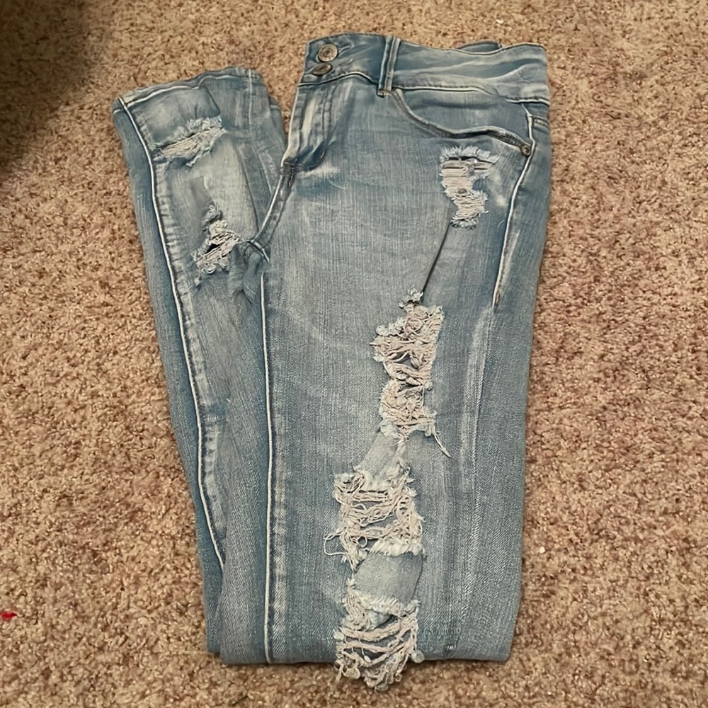 Light denim distressed/ripped jeans